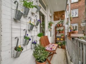 Small balcony garden that makes the most of a small space by applying principles of small space landscaping
