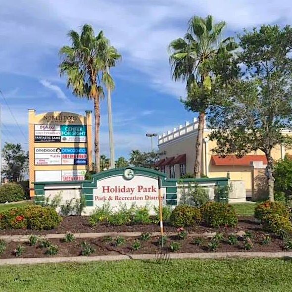 Holiday Park greenspace after new commercial landscape installation and planting in North Port Florida